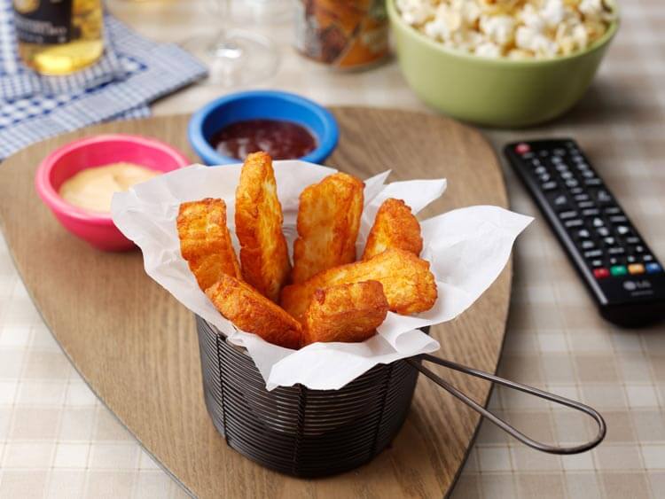 Halloumi fries in basket with dips