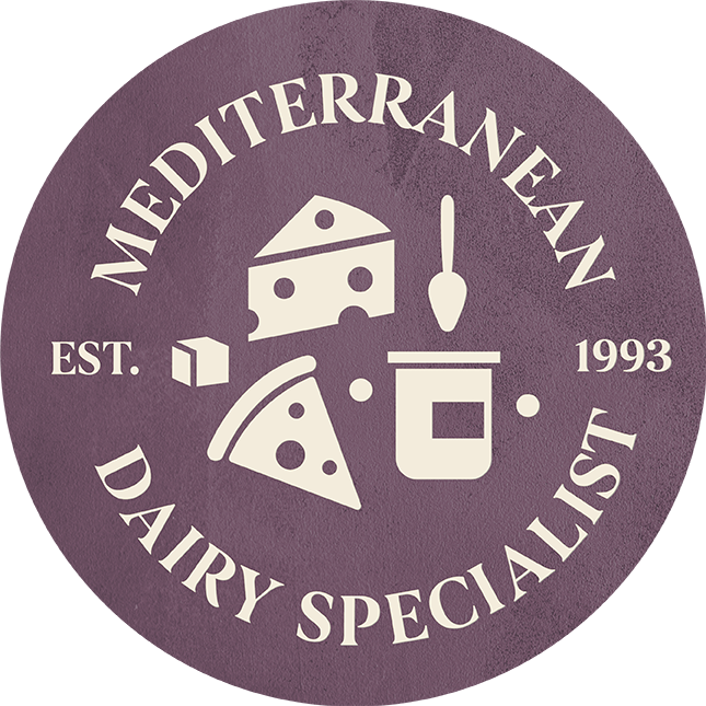 Mauve roundel with cheese icons on it and the words Mediterranean Dairy Specialist, est 1993